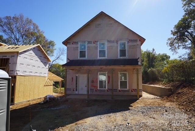 back of house with covered porch