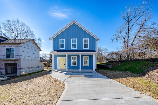 view of property featuring covered porch