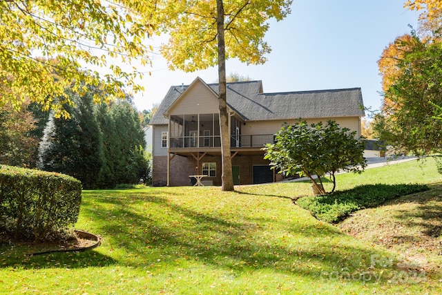 back of property with a sunroom and a lawn