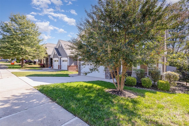 view of front of house featuring a front lawn and a garage