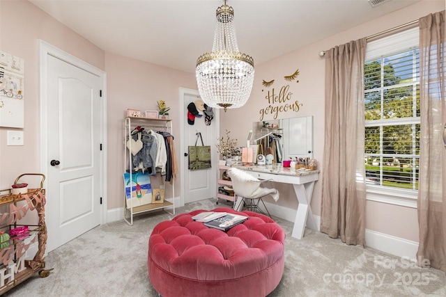 interior space featuring light carpet and a chandelier