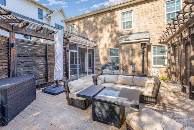 view of patio with a sunroom, an outdoor hangout area, and a pergola