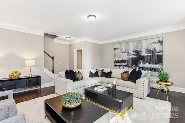 living room with dark hardwood / wood-style flooring and crown molding