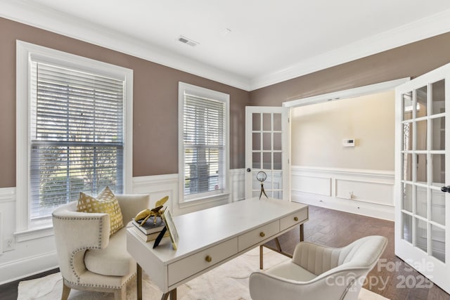 office featuring wood-type flooring, ornamental molding, and french doors