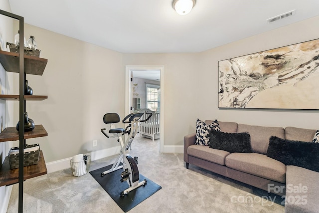 exercise room with light colored carpet