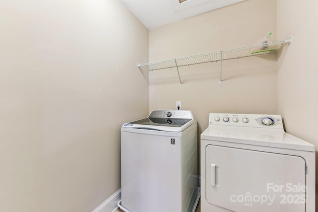 laundry area featuring washing machine and dryer