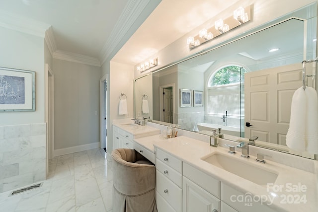 bathroom featuring vanity, a tub to relax in, and ornamental molding