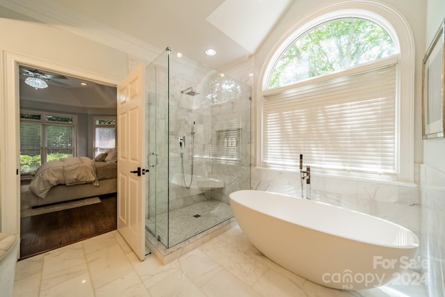 bathroom with crown molding, plus walk in shower, and ceiling fan