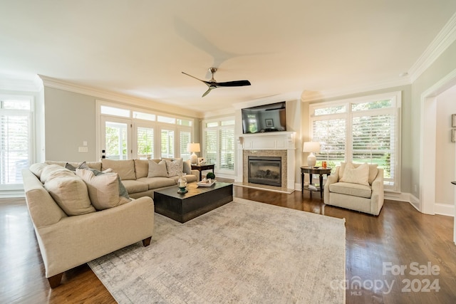 living room featuring crown molding, dark hardwood / wood-style floors, and ceiling fan