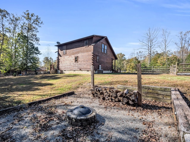 view of yard with a fire pit