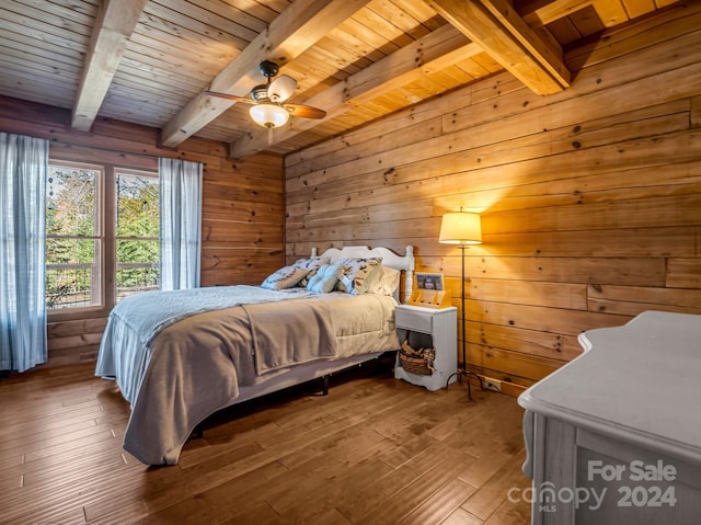 bedroom featuring beamed ceiling, wood ceiling, hardwood / wood-style flooring, and ceiling fan