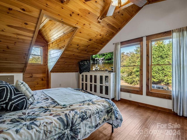 bedroom with multiple windows, hardwood / wood-style floors, lofted ceiling, and wood ceiling