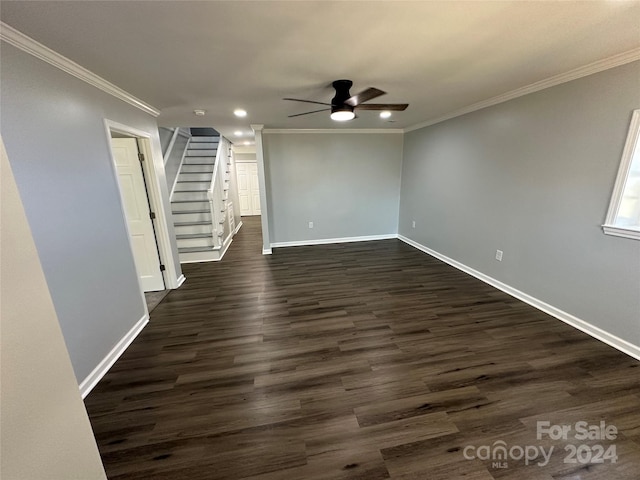 empty room with ornamental molding, ceiling fan, and dark hardwood / wood-style flooring