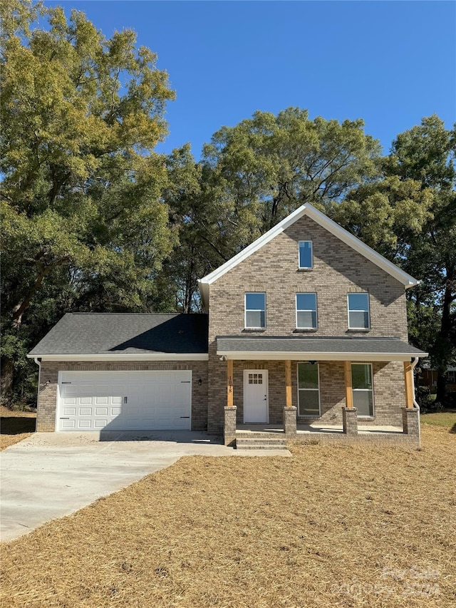 view of front facade with covered porch and a garage