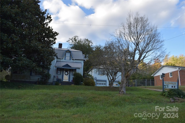 view of front of home with a front yard