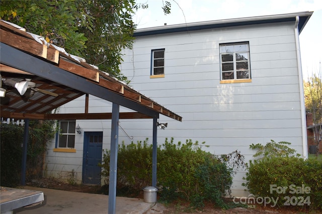 view of home's exterior featuring ceiling fan