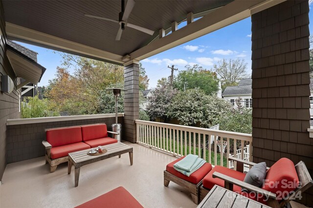 balcony with ceiling fan and an outdoor living space