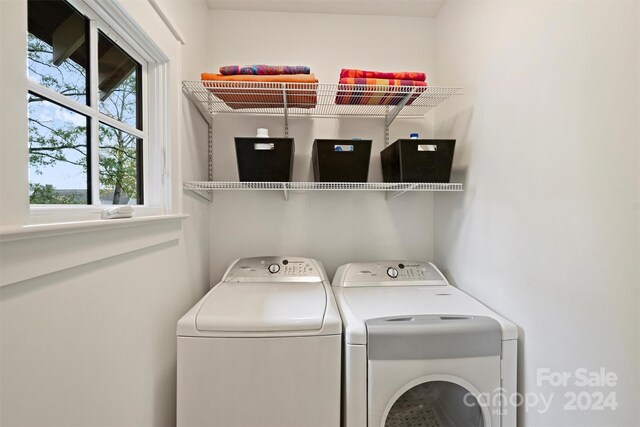 washroom with independent washer and dryer