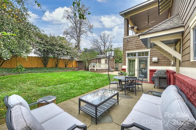 view of patio with area for grilling and an outdoor living space