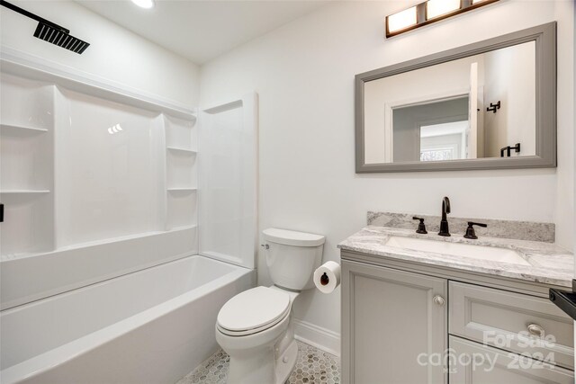 full bathroom featuring shower / bathing tub combination, tile patterned flooring, vanity, and toilet