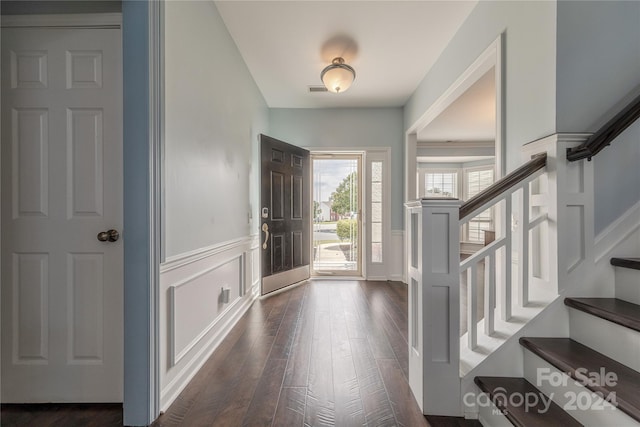 entryway with dark hardwood / wood-style floors