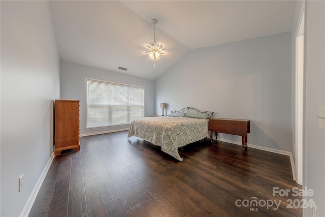 bedroom featuring vaulted ceiling and dark hardwood / wood-style floors