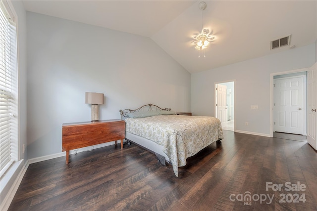 bedroom featuring lofted ceiling and dark hardwood / wood-style flooring