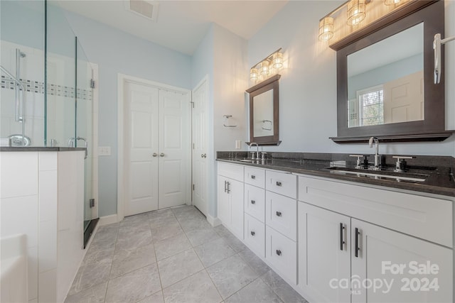 bathroom with vanity, tile patterned floors, and an enclosed shower