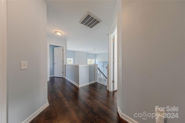 hallway featuring dark hardwood / wood-style floors