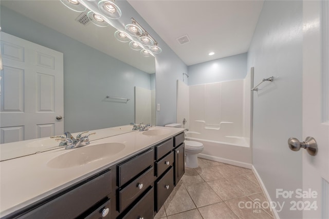 full bathroom with vanity, toilet, shower / bath combination, and tile patterned flooring