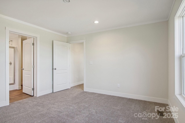 unfurnished bedroom featuring light colored carpet and ornamental molding