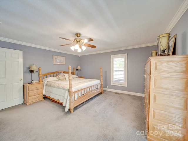 bedroom with ornamental molding, carpet flooring, and ceiling fan