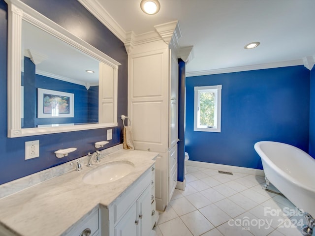 bathroom featuring vanity, crown molding, tile patterned floors, and a bath