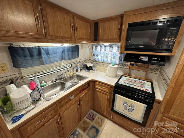 kitchen with sink and black microwave