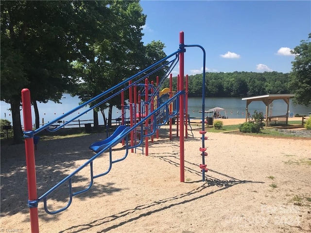 view of play area with a water view