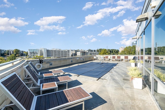 view of pool featuring a patio