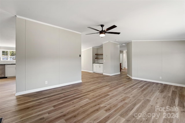 unfurnished living room with ornamental molding, light wood-type flooring, and ceiling fan