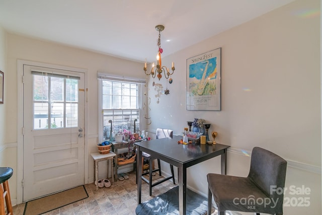 dining space with a notable chandelier