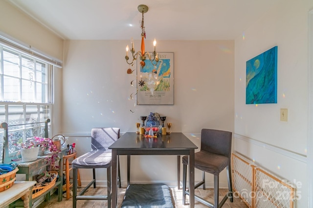 dining area with a notable chandelier