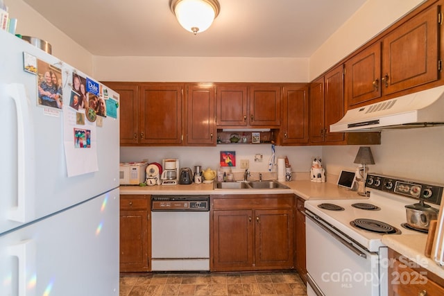 kitchen with sink and white appliances