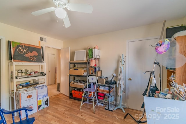 interior space with light hardwood / wood-style flooring and ceiling fan