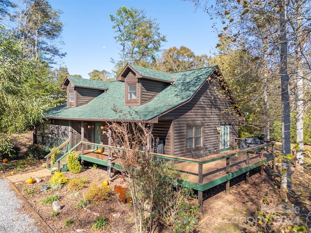 log-style house featuring a deck