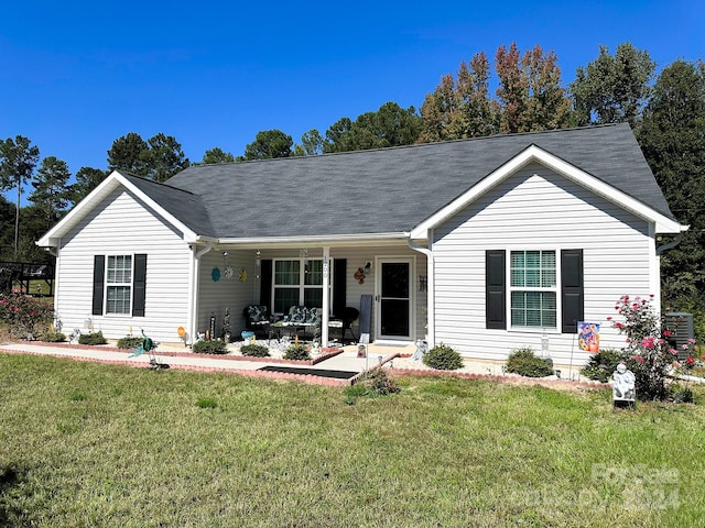 single story home featuring a front lawn