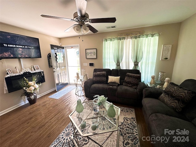 living room with ceiling fan and hardwood / wood-style flooring