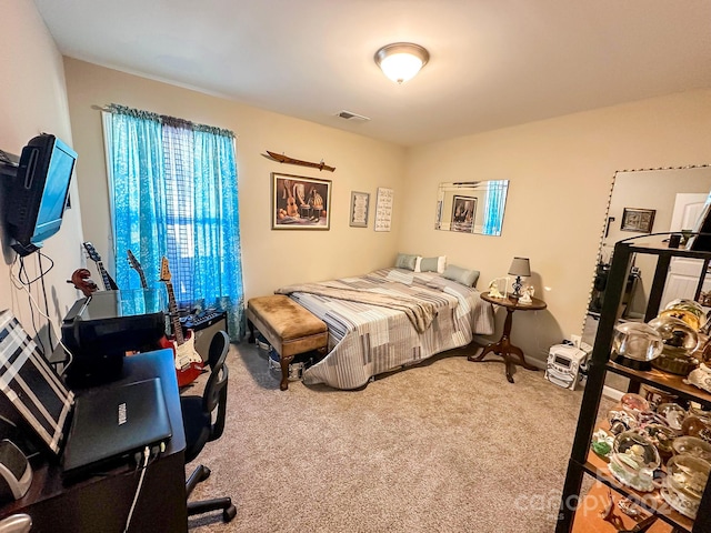 bedroom featuring carpet