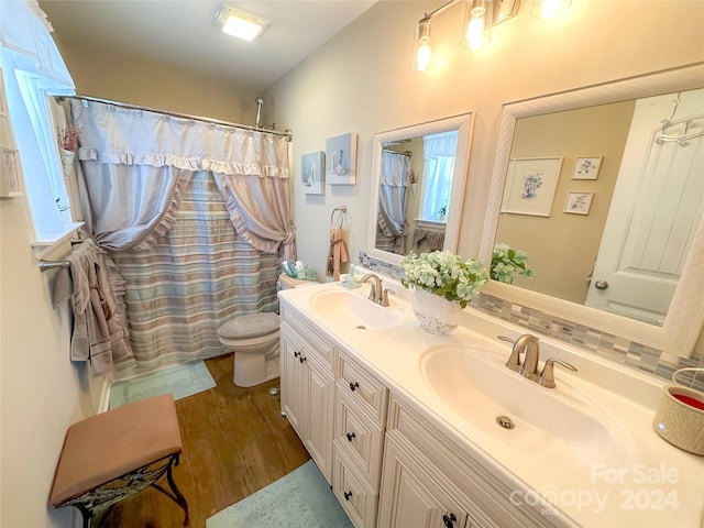 bathroom with vanity, hardwood / wood-style flooring, toilet, and a shower with curtain