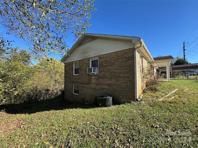 view of home's exterior with cooling unit and a yard