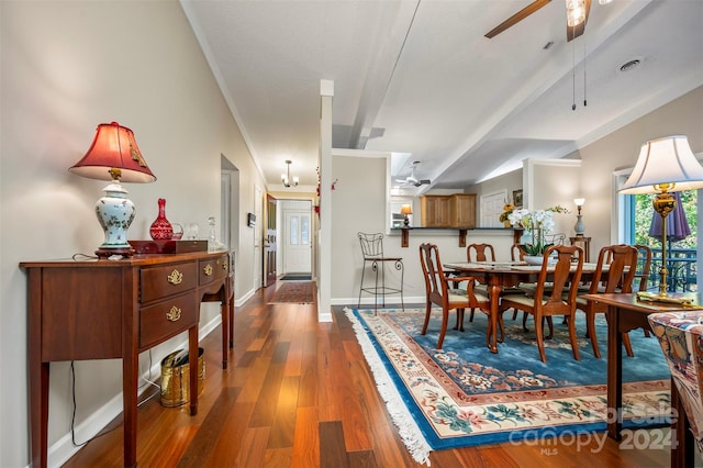 dining area with wood-type flooring and ceiling fan