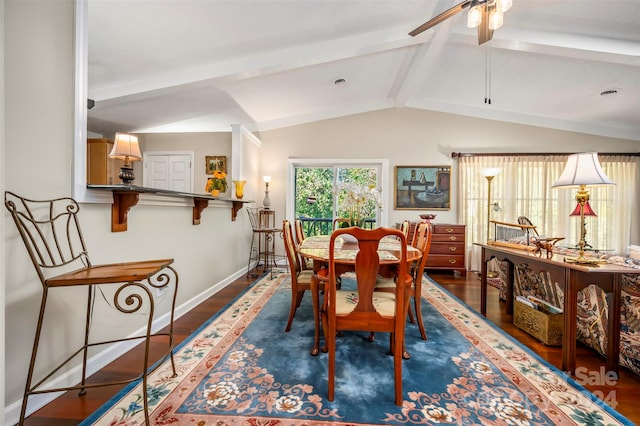 dining area with vaulted ceiling with beams, ceiling fan, and dark hardwood / wood-style flooring