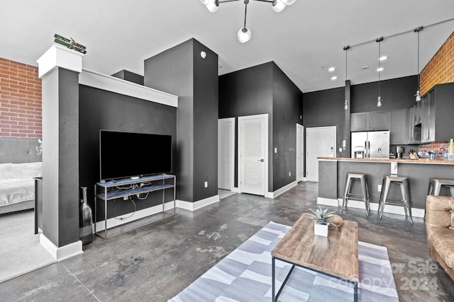 living room featuring a towering ceiling